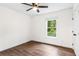 Bedroom featuring wood-look flooring, natural light, and a closet at 578 Cedar Avenue, Atlanta, GA 30318