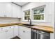 Bright kitchen featuring butcher block countertops, stainless steel appliances, and subway tile backsplash at 578 Cedar Avenue, Atlanta, GA 30318