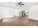 A spacious living room with sleek ceiling fan and modern flooring, flowing into the kitchen at 578 Cedar Avenue, Atlanta, GA 30318