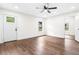 Inviting living room with wood flooring, large window and modern ceiling fan with an outdoor view at 578 Cedar Avenue, Atlanta, GA 30318