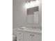 Modern bathroom with white vanity and a framed mirror at 1112 Kensington Ct, Johns Creek, GA 30022