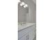 Stylish bathroom features a modern vanity with a quartz countertop and brushed nickel fixtures at 1112 Kensington Ct, Johns Creek, GA 30022