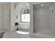 Spa-like bathroom features a freestanding tub, large window, and glass-enclosed shower at 1112 Kensington Ct, Johns Creek, GA 30022