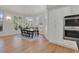 Dining area with hardwood floors, many windows, and built in oven at 1112 Kensington Ct, Johns Creek, GA 30022