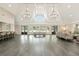 Open floor plan event space with high ceilings, chandeliers, bar and lounge seating at 1112 Kensington Ct, Johns Creek, GA 30022