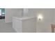 Light-filled hallway with neutral tones and modern lighting at 1112 Kensington Ct, Johns Creek, GA 30022