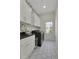 Well-equipped laundry room with modern washer, dryer, and ample cabinet space at 1112 Kensington Ct, Johns Creek, GA 30022