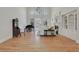 Bright living room with a piano, fireplace, built-ins, and large windows at 1112 Kensington Ct, Johns Creek, GA 30022