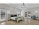 Spacious main bedroom with tray ceilings, hardwood floors, and access to the backyard at 1112 Kensington Ct, Johns Creek, GA 30022