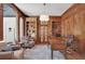 Wood-paneled office with built-in bookshelves and a large desk at 1112 Kensington Ct, Johns Creek, GA 30022