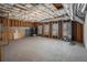 Unfinished basement with exposed ceiling and walls and concrete floor at 117 Olde Heritage Way, Woodstock, GA 30188