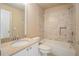 This bathroom has a granite vanity, tile backsplash and a shower over tub at 117 Olde Heritage Way, Woodstock, GA 30188