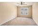 Bedroom with carpet and window with a view of neighborhood at 117 Olde Heritage Way, Woodstock, GA 30188
