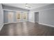 This living room has hardwood floors, a door to the exterior and many windows at 117 Olde Heritage Way, Woodstock, GA 30188