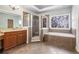 Main bathroom featuring double vanity, glass shower, and separate soaking tub at 117 Olde Heritage Way, Woodstock, GA 30188