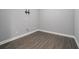 This room features grey walls, laminate floors and a mount for a TV at 117 Olde Heritage Way, Woodstock, GA 30188