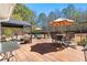 Large wooden deck featuring multiple seating areas, umbrellas, and a gazebo at 340 Housman Dr, Fayetteville, GA 30215