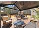Wooden back deck boasts comfortable lounge area, outdoor seating and lush backyard views at 340 Housman Dr, Fayetteville, GA 30215
