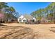 Large backyard with a house, detached shed, and a deck for outdoor living and entertaining at 340 Housman Dr, Fayetteville, GA 30215