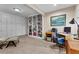 Finished basement area with built-in bookcases, a desk and an adjacent storage space at 340 Housman Dr, Fayetteville, GA 30215