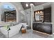 Beautiful bathroom featuring a luxurious soaking tub, glass shower, and marble floors at 340 Housman Dr, Fayetteville, GA 30215