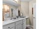 Bathroom vanity with dual lamps and neutral finishes at 340 Housman Dr, Fayetteville, GA 30215