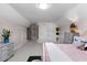 Bright bedroom with built-in shelves, sloped ceilings and carpeted floors at 340 Housman Dr, Fayetteville, GA 30215