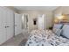 Bedroom view with white trim, double doors, and patterned bedspread at 340 Housman Dr, Fayetteville, GA 30215