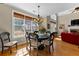 Cozy breakfast nook with hardwood floors, a chandelier, and a large window at 340 Housman Dr, Fayetteville, GA 30215