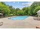 Large community pool with lounge chairs and umbrellas for residents at 340 Housman Dr, Fayetteville, GA 30215