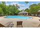Community pool with lounge chairs and umbrellas at 340 Housman Dr, Fayetteville, GA 30215