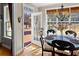 Cozy dining area with natural light, glass top table, and hardwood flooring at 340 Housman Dr, Fayetteville, GA 30215