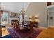 Elegant dining room with hardwood floors, a fireplace, and a chandelier at 340 Housman Dr, Fayetteville, GA 30215