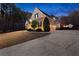 Beautifully landscaped property showcasing a two-story home, mature trees, and a long driveway at 340 Housman Dr, Fayetteville, GA 30215
