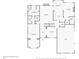 First floor layout with a primary bedroom, foyer, living room, and a two-car garage at 340 Housman Dr, Fayetteville, GA 30215