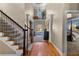 Grand foyer with hardwood floors, high ceilings, staircase, and decorative chandelier, creating an inviting entrance at 340 Housman Dr, Fayetteville, GA 30215