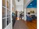 Welcoming foyer with hardwood floors, chandelier, staircase, and views of the formal living spaces at 340 Housman Dr, Fayetteville, GA 30215