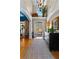 Elegant foyer with high ceilings, chandelier, hardwood floors and an open view to the front yard and garden at 340 Housman Dr, Fayetteville, GA 30215