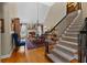 Spacious foyer with hardwood floors, stairs and views of the dining room, creating an inviting entrance at 340 Housman Dr, Fayetteville, GA 30215