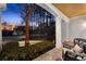 Charming covered front porch with comfortable seating and a view of the landscaped front yard at 340 Housman Dr, Fayetteville, GA 30215