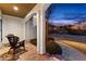 Inviting covered front porch with stone flooring and comfortable seating, perfect for relaxing outdoors at 340 Housman Dr, Fayetteville, GA 30215