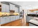 Charming kitchen with stainless steel appliances and white custom cabinetry at 340 Housman Dr, Fayetteville, GA 30215
