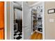 View into the laundry area and pantry, with ample storage on white shelves at 340 Housman Dr, Fayetteville, GA 30215