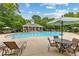 Community pool area with ample seating, lounge chairs, and covered seating near the pool house at 340 Housman Dr, Fayetteville, GA 30215