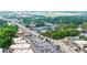 High-angle aerial shot with the commercial district, airport landing strip, and lush green neighborhood at 3665 Chestnut Dr # A2, Atlanta, GA 30340
