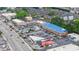 Aerial view of a bustling commercial district with various businesses, ample parking, and easy access to major roads at 3665 Chestnut Dr # A2, Atlanta, GA 30340
