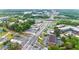 Wide aerial view showing the surrounding neighborhood, commercial areas, highway access, and lush greenery at 3665 Chestnut Dr # A2, Atlanta, GA 30340