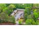 Overhead aerial of the well-maintained apartment building surrounded by lush green landscaping and a private parking lot at 3665 Chestnut Dr # A2, Atlanta, GA 30340