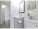 Bathroom featuring a gray vanity and modern fixtures with grey vinyl flooring at 3665 Chestnut Dr # A2, Atlanta, GA 30340