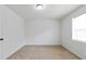 This bedroom features a window that provides plenty of natural light, as well as neutral carpeting at 3665 Chestnut Dr # A2, Atlanta, GA 30340